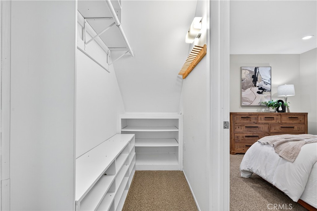 30 Nuevo, Unit 15 Irvine, CA 92612 - Photo 50 of 69 a view of bedroom and bedroom with wooden floor