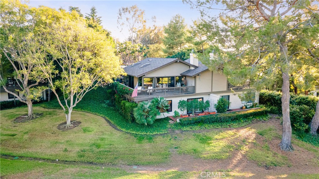 30 Nuevo, Unit 15 Irvine, CA 92612 - Photo 54 of 69 a front view of a house with garden