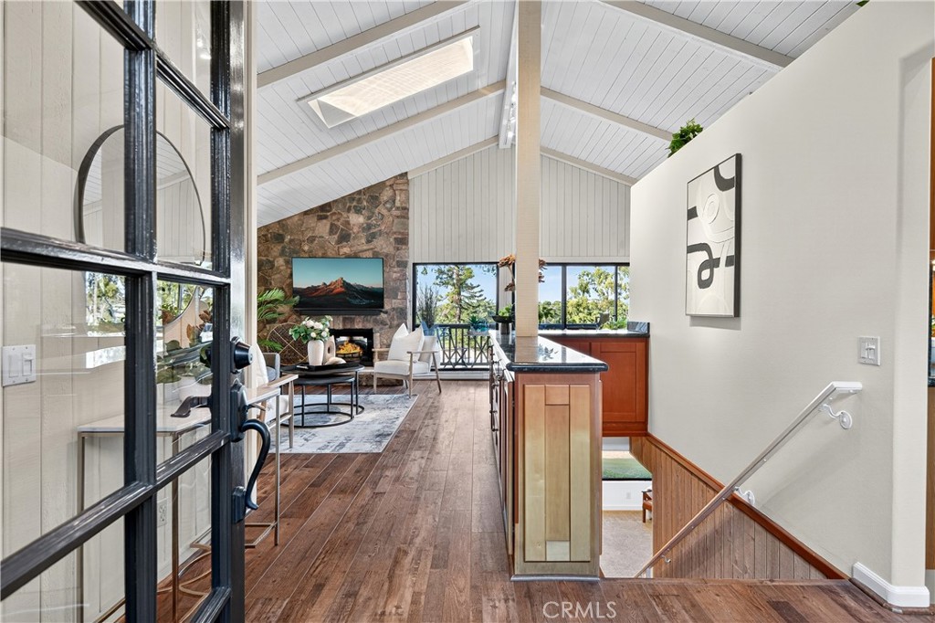 30 Nuevo, Unit 15 Irvine, CA 92612 - Photo 7 of 69 a view of a dining room with furniture a chandelier and wooden floor