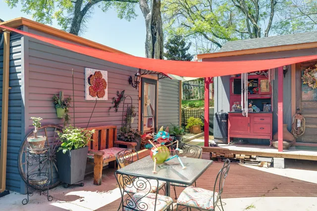 a view of backyard with outdoor seating