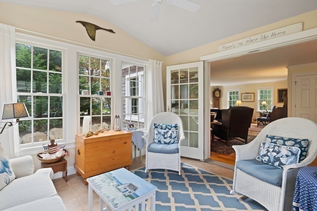 100 Round Cove Road Chatham, MA 02633 - Photo 13 of 38 a living room with furniture and floor to ceiling windows
