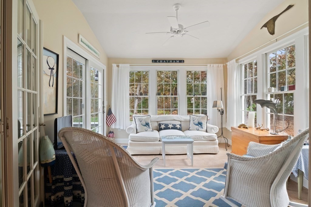 100 Round Cove Road Chatham, MA 02633 - Photo 14 of 38 a living room with furniture and large windows