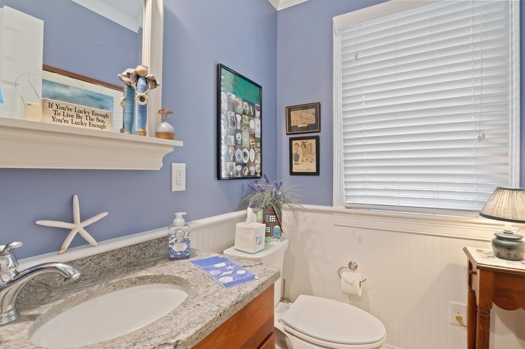 100 Round Cove Road Chatham, MA 02633 - Photo 19 of 38 a bathroom with a granite countertop sink mirror and toilet