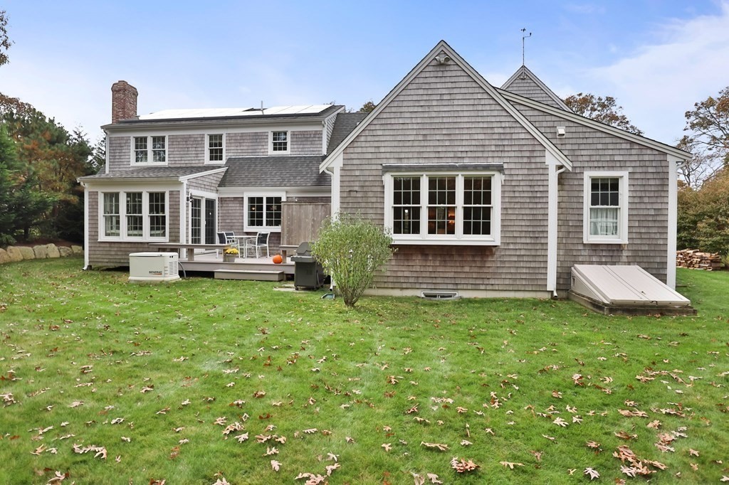100 Round Cove Road Chatham, MA 02633 - Photo 26 of 38 a view of a house with backyard and porch