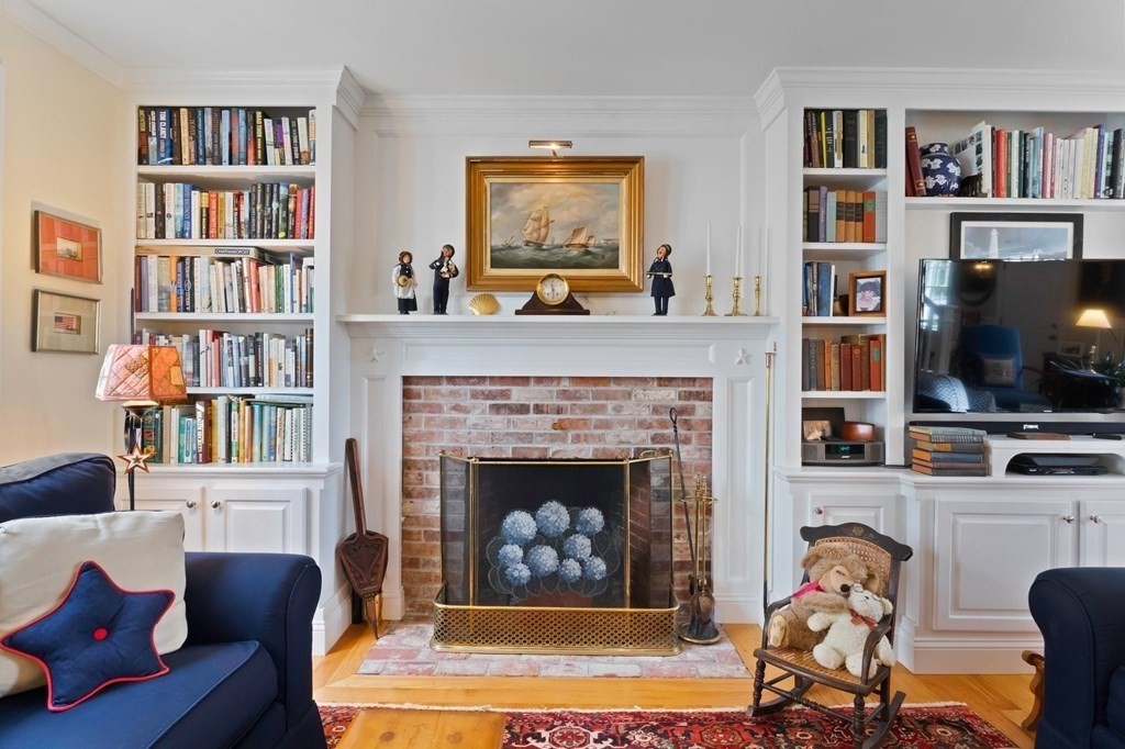 100 Round Cove Road Chatham, MA 02633 - Photo 3 of 38 a living room with furniture and a fireplace