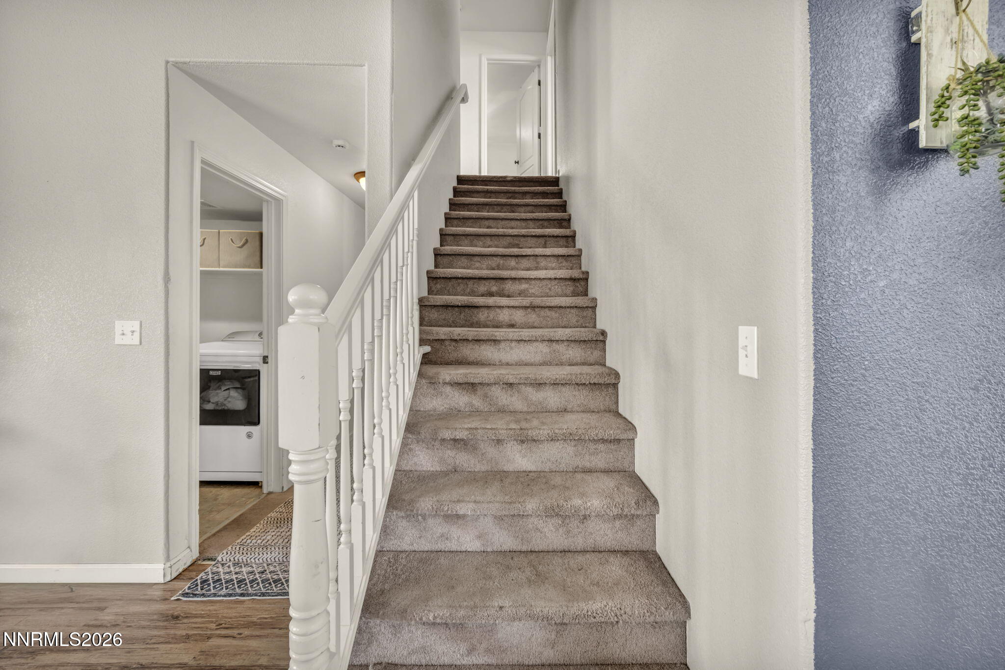 17615 Baileyville Court Reno, NV 89508 - Photo 8 of 19 a view of staircase with white walls and windows