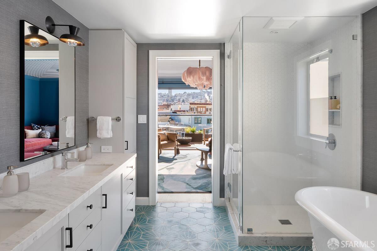45 Capra Way San Francisco, CA 94123 - Photo 13 of 25 a bathroom with a double vanity sink a mirror and a shower