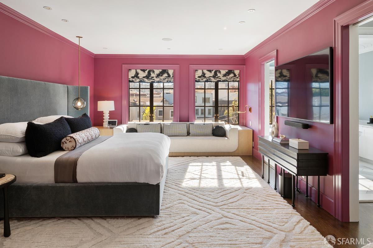 45 Capra Way San Francisco, CA 94123 - Photo 14 of 25 a large bedroom with a bed and wooden floor