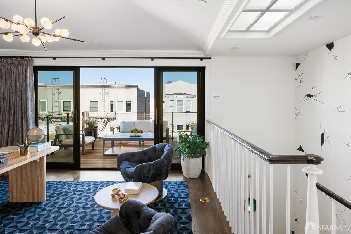 45 Capra Way San Francisco, CA 94123 - Photo 16 of 25 a living room with furniture a fireplace and a chandelier