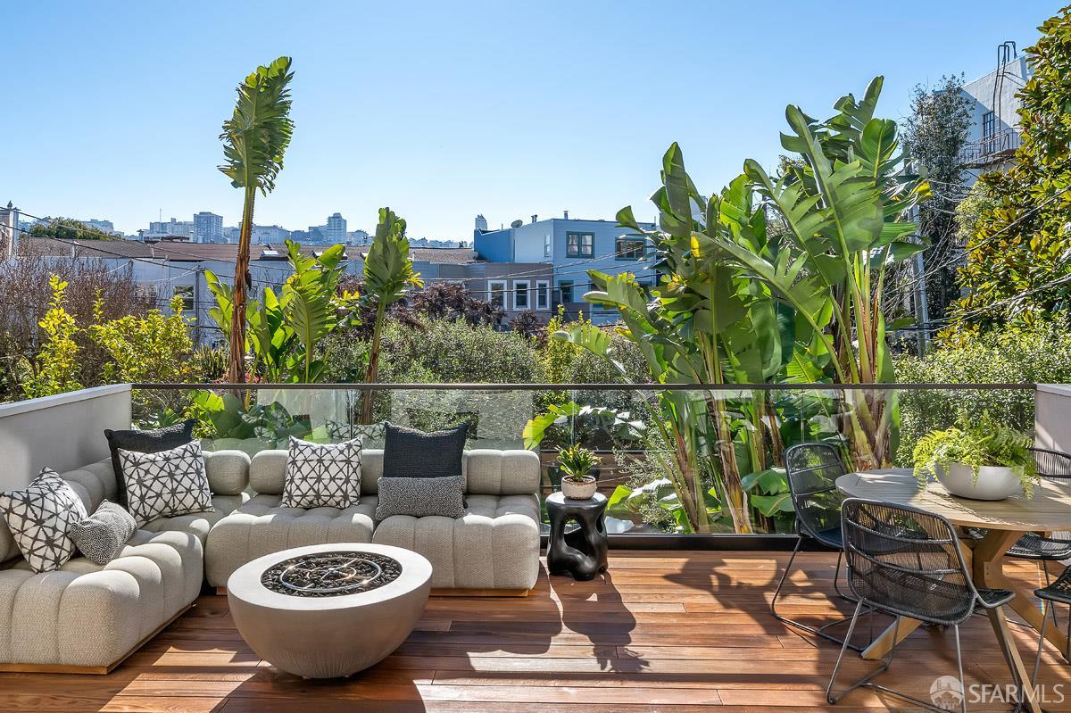 45 Capra Way San Francisco, CA 94123 - Photo 10 of 25 a view of a patio with couches table and chairs and potted plants
