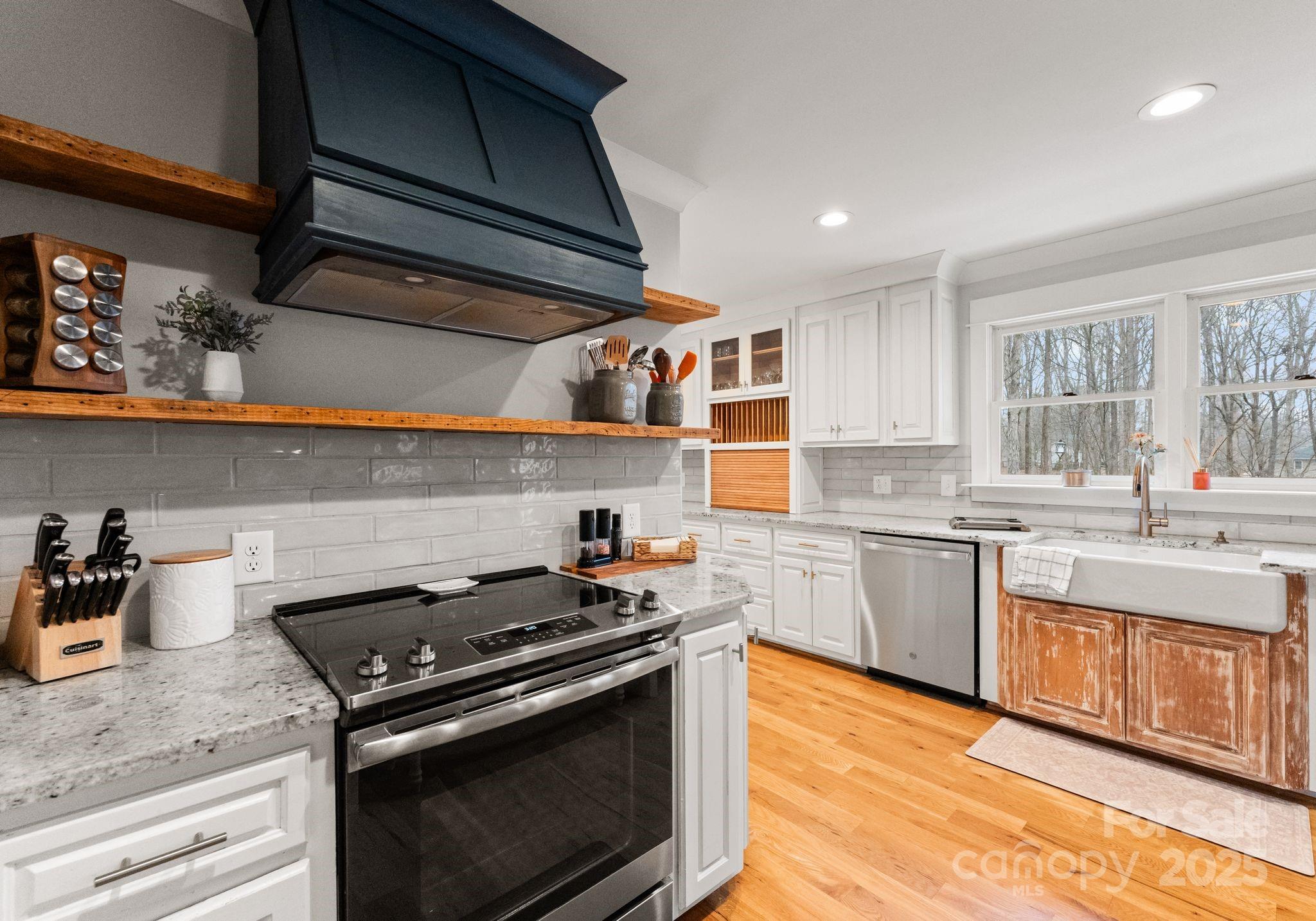 2550 Green Point Court Denver, NC 28037 - Photo 13 of 42 a kitchen with stainless steel appliances granite countertop a stove and a sink