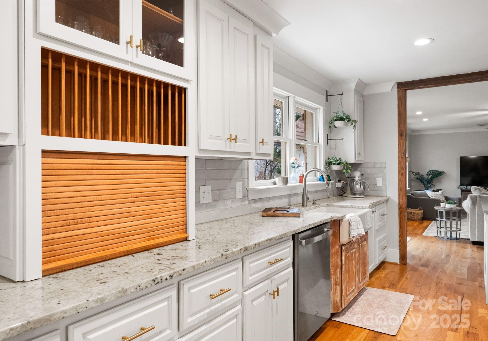 2550 Green Point Court Denver, NC 28037 - Photo 14 of 42 a kitchen with granite countertop white cabinets and white appliances