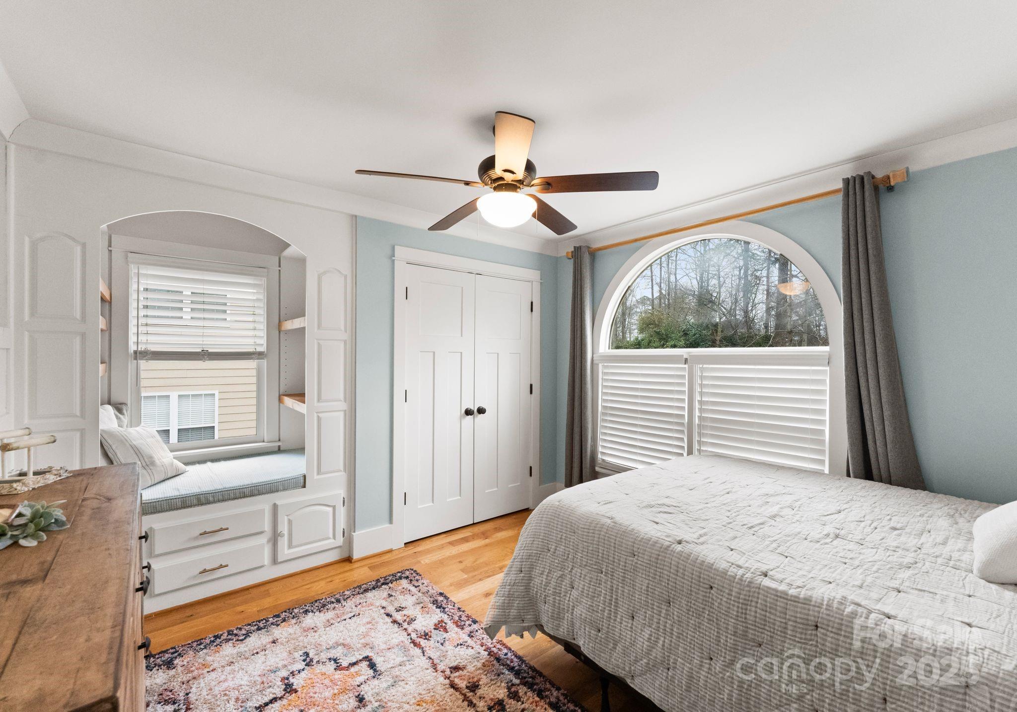 2550 Green Point Court Denver, NC 28037 - Photo 22 of 42 a bedroom with a bed and a chandelier