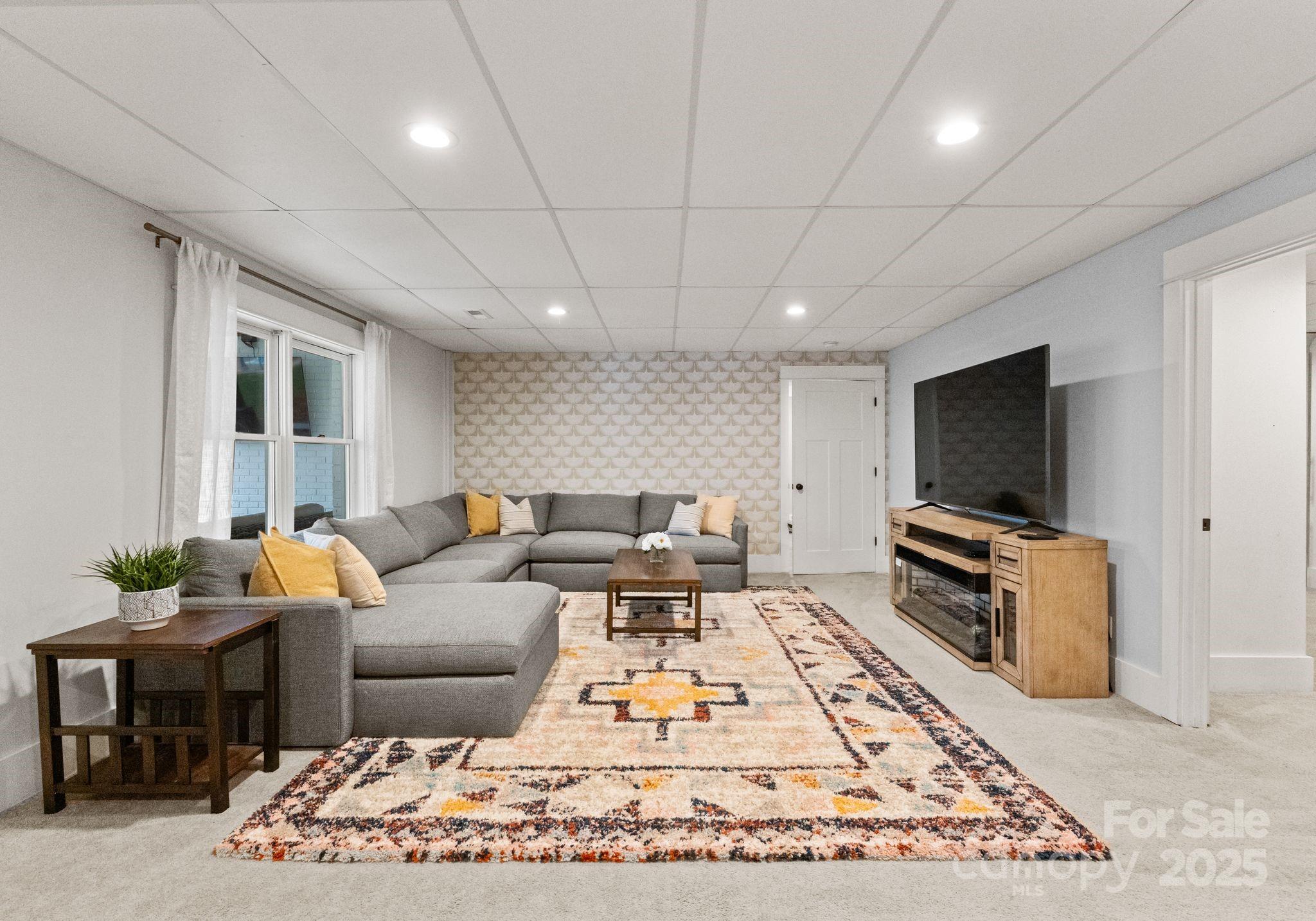 2550 Green Point Court Denver, NC 28037 - Photo 25 of 42 a living room with furniture and a flat screen tv