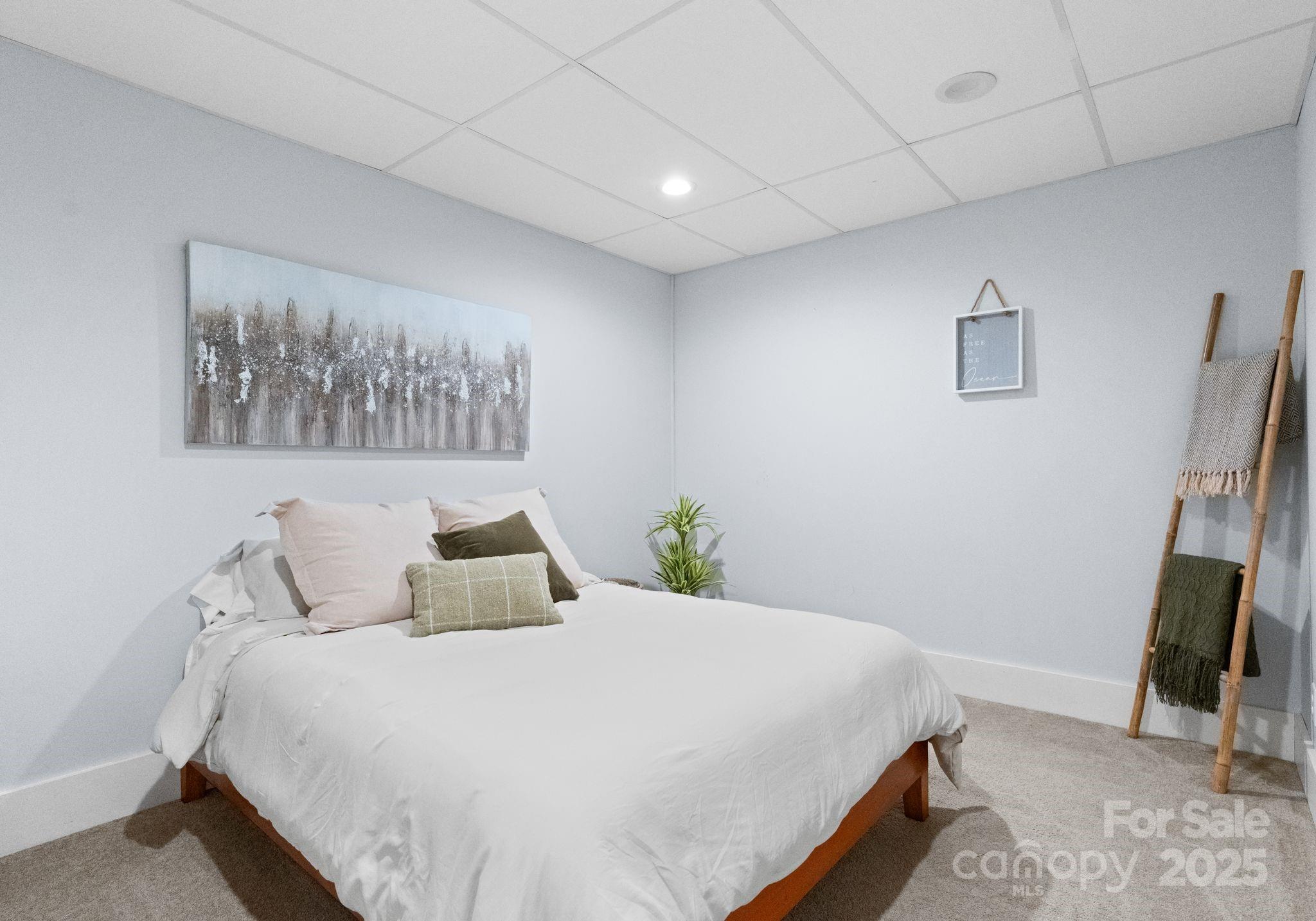 2550 Green Point Court Denver, NC 28037 - Photo 29 of 42 a bedroom with a bed and a painting on the wall