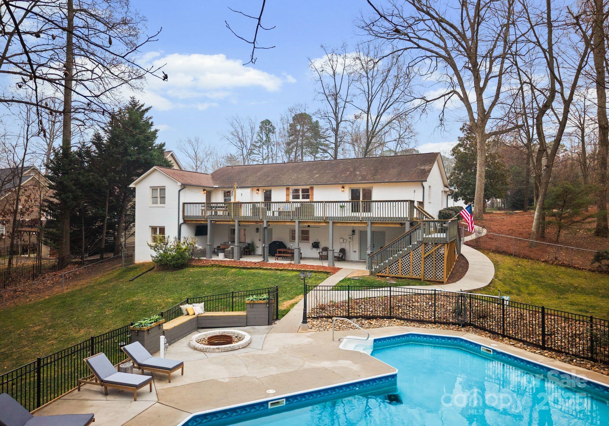 2550 Green Point Court Denver, NC 28037 - Photo 31 of 42 a view of a house with backyard sitting area and pool
