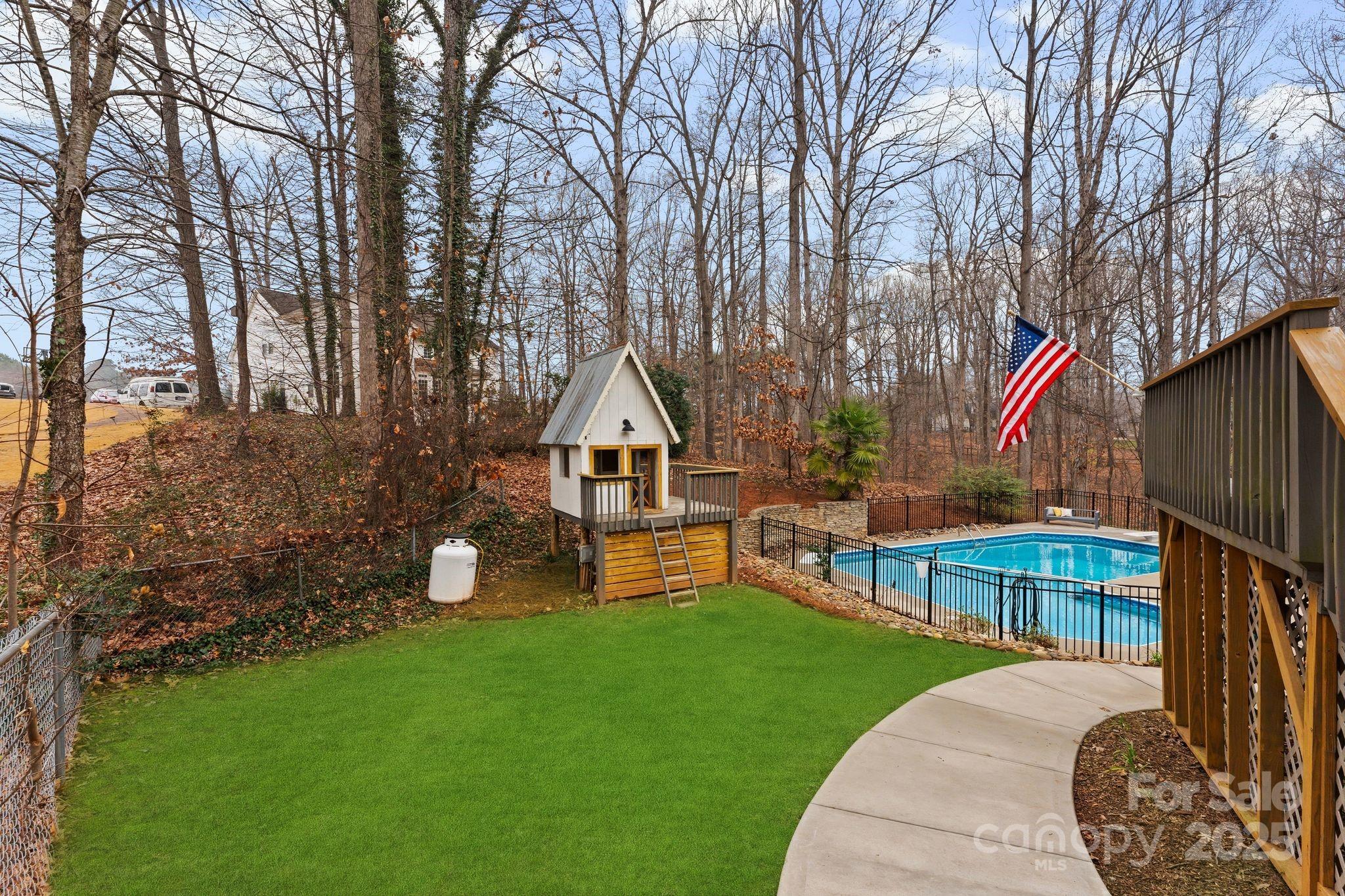 2550 Green Point Court Denver, NC 28037 - Photo 32 of 42 a front view of a house with garden