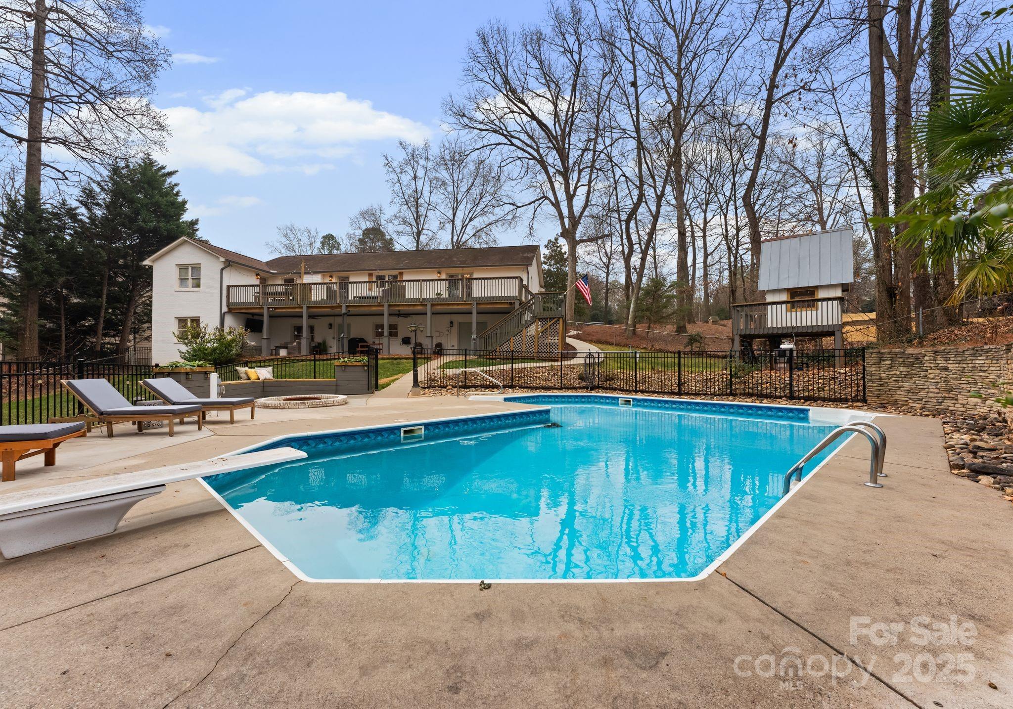 2550 Green Point Court Denver, NC 28037 - Photo 39 of 42 a view of a swimming pool with a lounge chairs