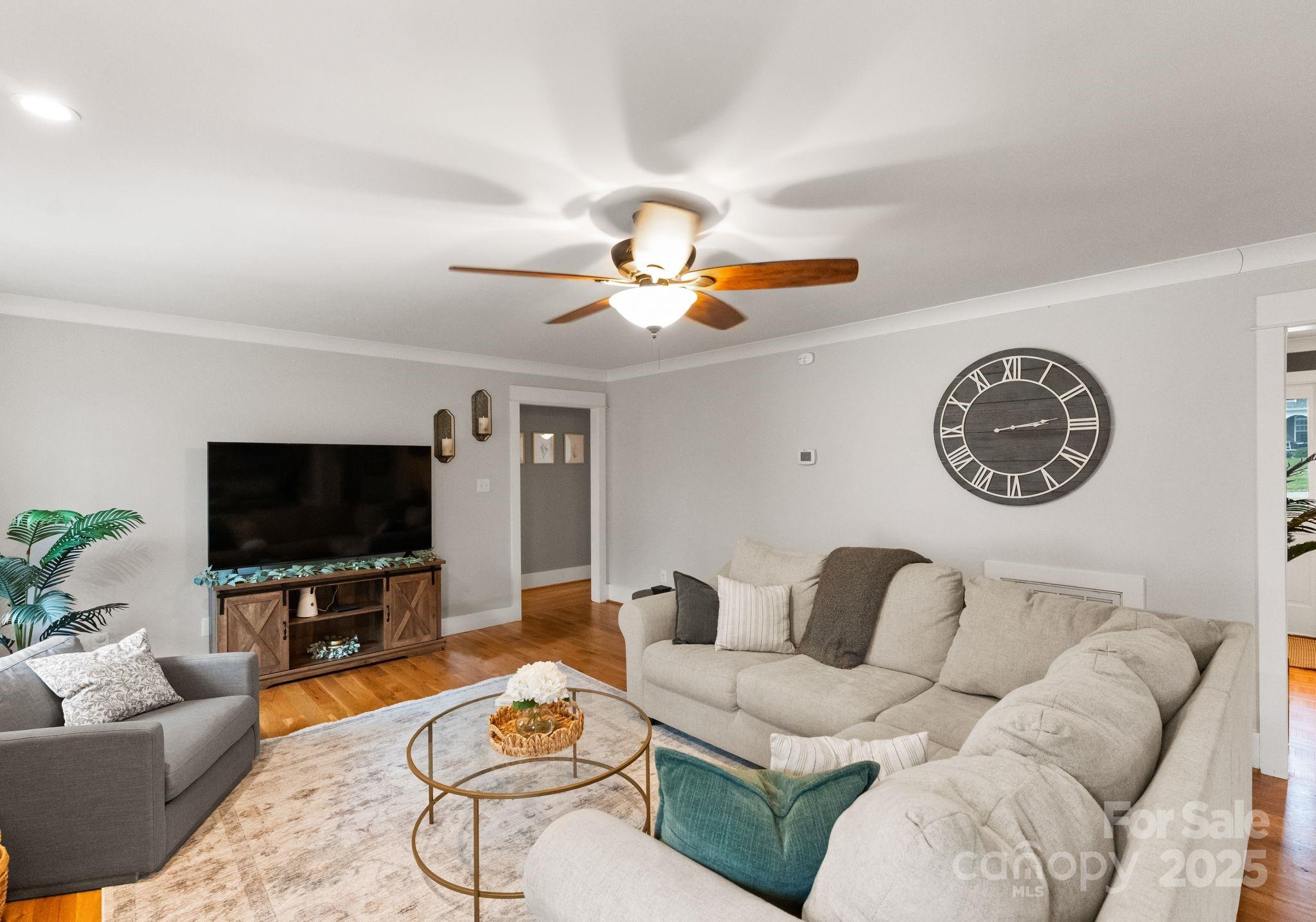 2550 Green Point Court Denver, NC 28037 - Photo 8 of 42 a living room with furniture and a flat screen tv