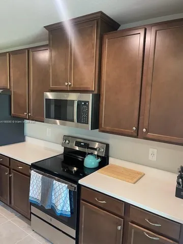 a kitchen with a sink and a microwave