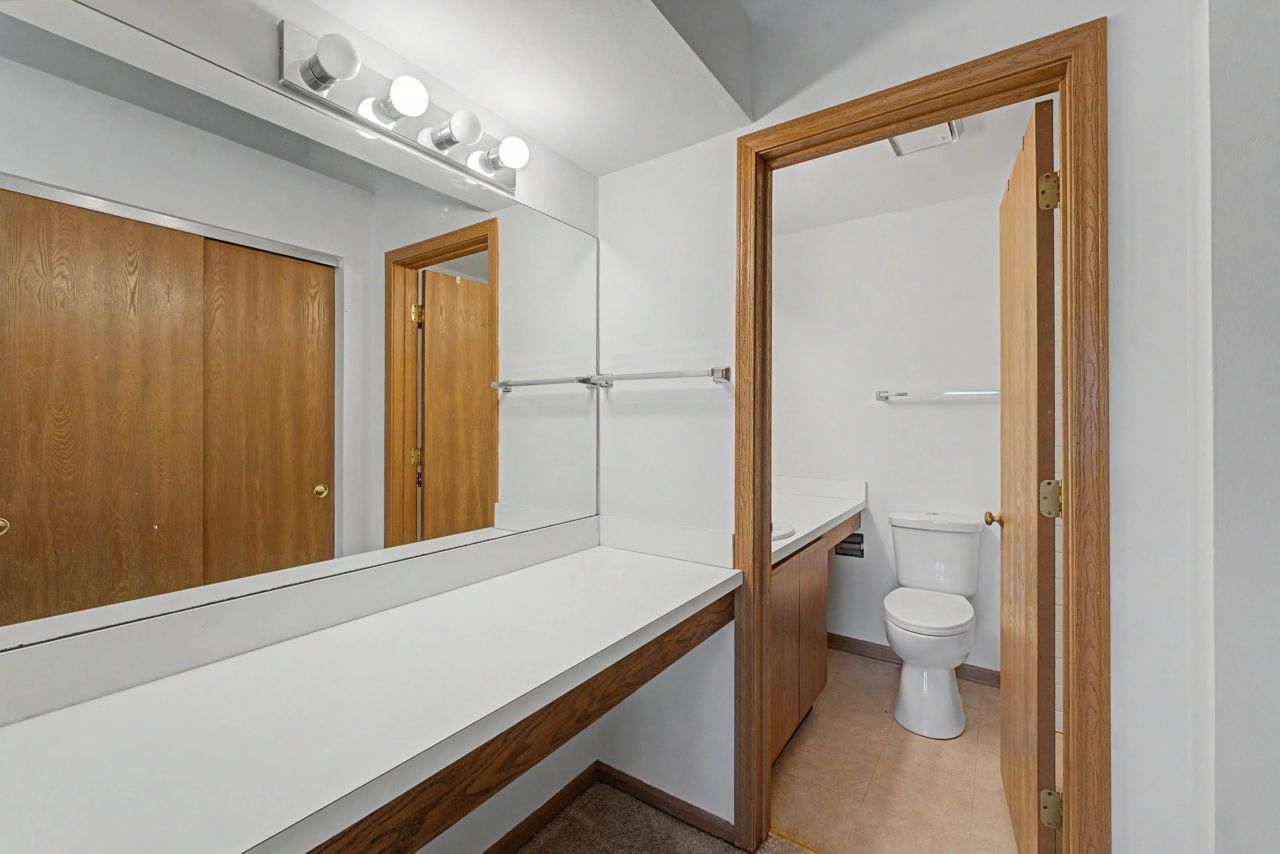 1953 North Coldspring Road Arlington Heights, IL 60004 - Photo 16 of 27 a bathroom with a sink a toilet and shower