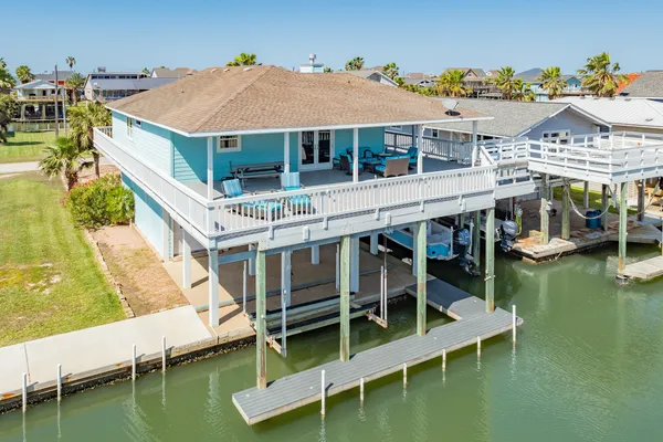 a balcony with table and chairs