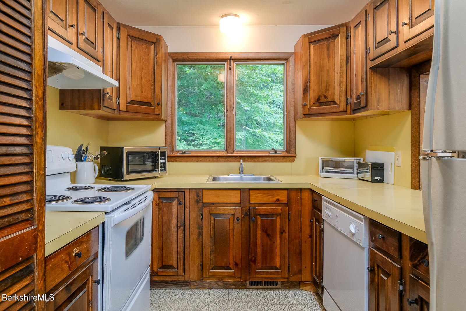 3023 Hancock Road Hancock, MA 01267 - Photo 15 of 23 a utility room with stainless steel appliances granite countertop a sink and a stove