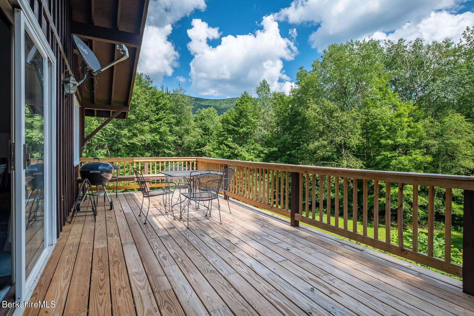 3023 Hancock Road Hancock, MA 01267 - Photo 6 of 23 a view of balcony with chairs and wooden floor