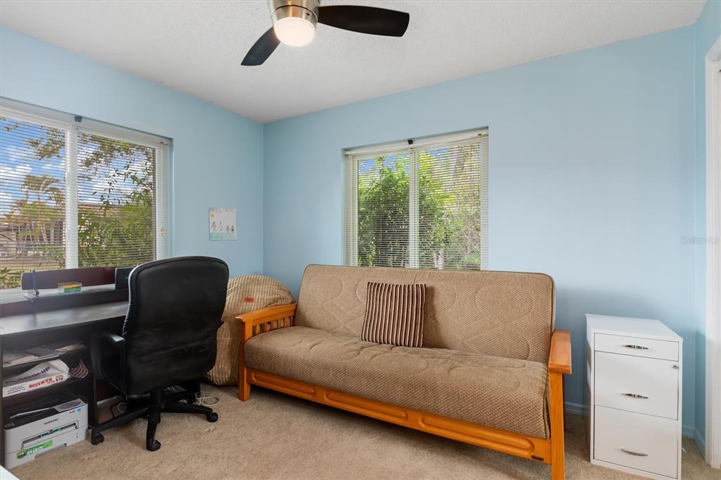 23226 Midway Boulevard Punta Gorda, FL 33980 - Photo 19 of 37 a living room with furniture and a window