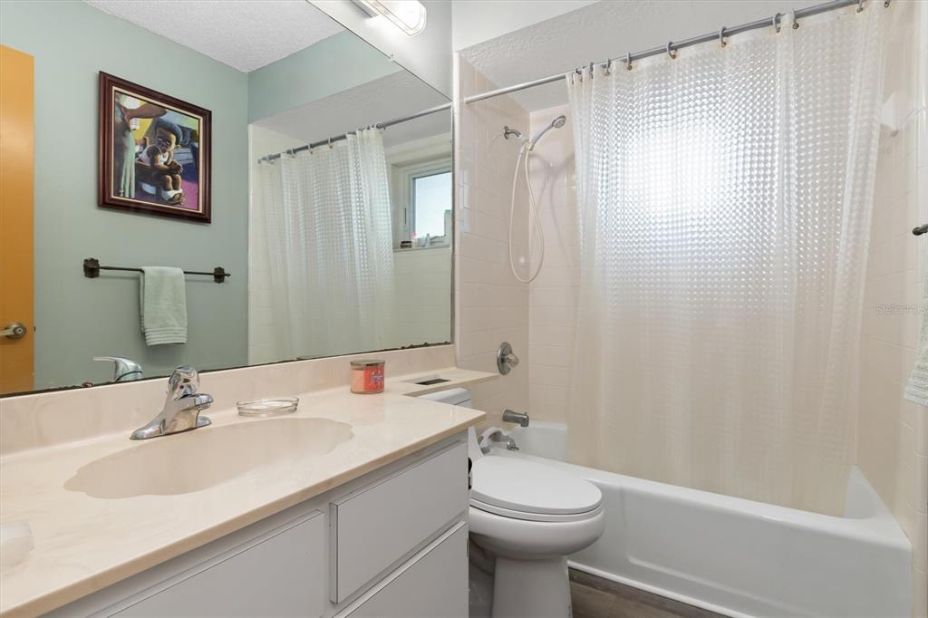 23226 Midway Boulevard Punta Gorda, FL 33980 - Photo 20 of 37 a bathroom with a sink toilet and shower