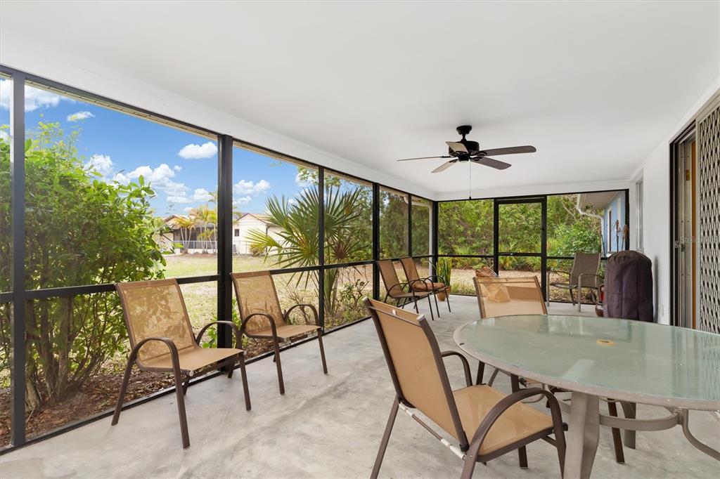 23226 Midway Boulevard Punta Gorda, FL 33980 - Photo 21 of 37 a view of a dining room with furniture window and outside view