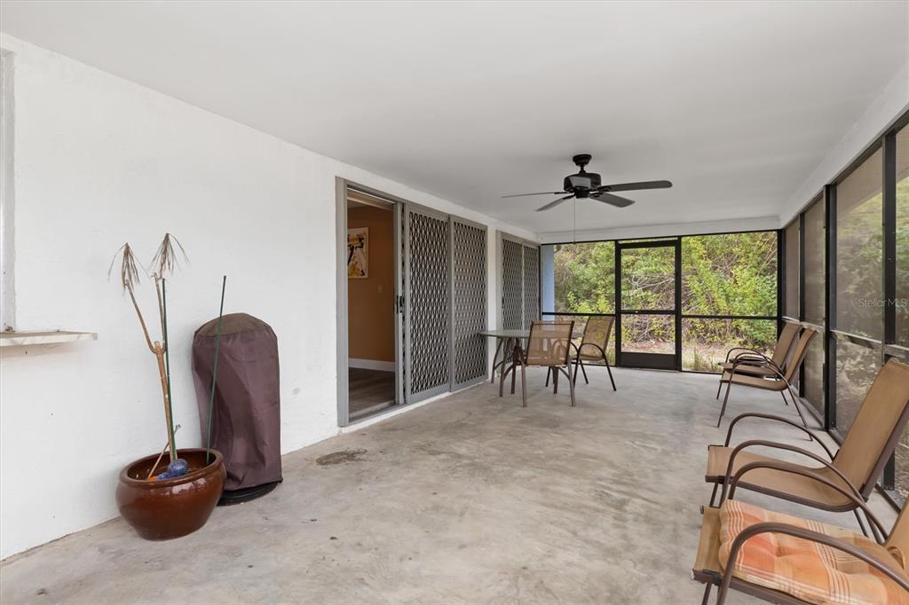 23226 Midway Boulevard Punta Gorda, FL 33980 - Photo 23 of 37 a view of a livingroom with furniture and a large window