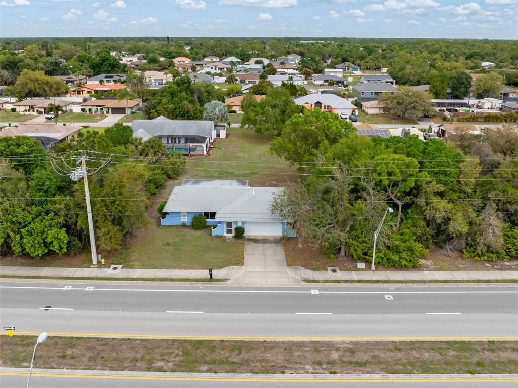 23226 Midway Boulevard Punta Gorda, FL 33980 - Photo 33 of 37 an aerial view of residential houses with outdoor space and parking