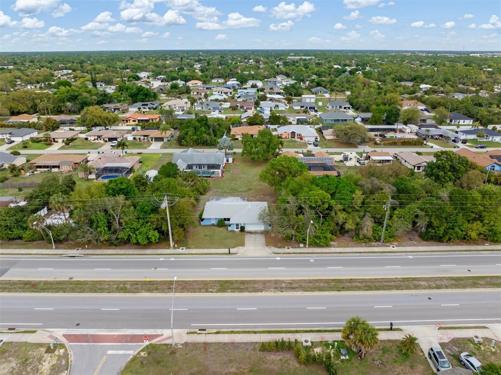 23226 Midway Boulevard Punta Gorda, FL 33980 - Photo 35 of 37 an aerial view of residential houses with outdoor space and street view