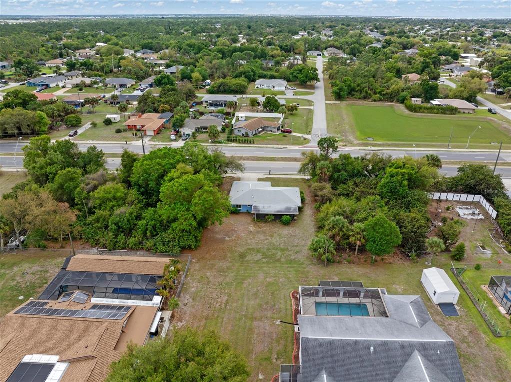 23226 Midway Boulevard Punta Gorda, FL 33980 - Photo 36 of 37 an aerial view of residential houses with outdoor space and parking space