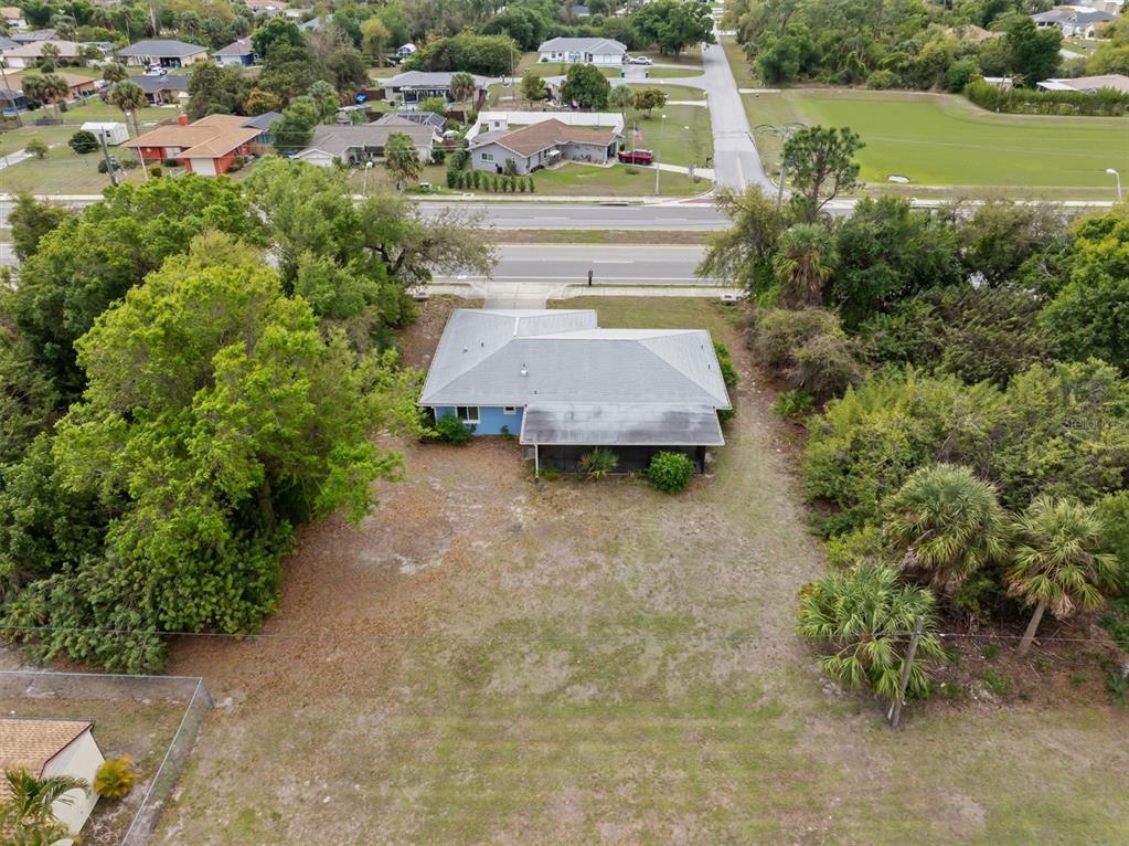 23226 Midway Boulevard Punta Gorda, FL 33980 - Photo 37 of 37 an aerial view of a house with yard swimming pool and outdoor seating