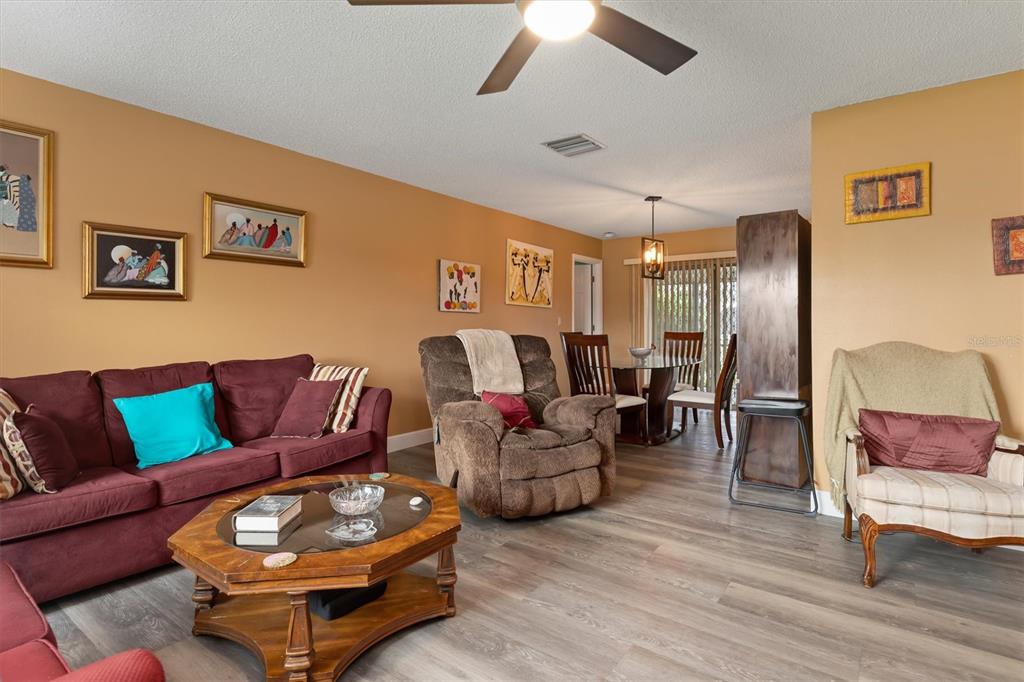 23226 Midway Boulevard Punta Gorda, FL 33980 - Photo 4 of 37 a living room with furniture and wooden floor