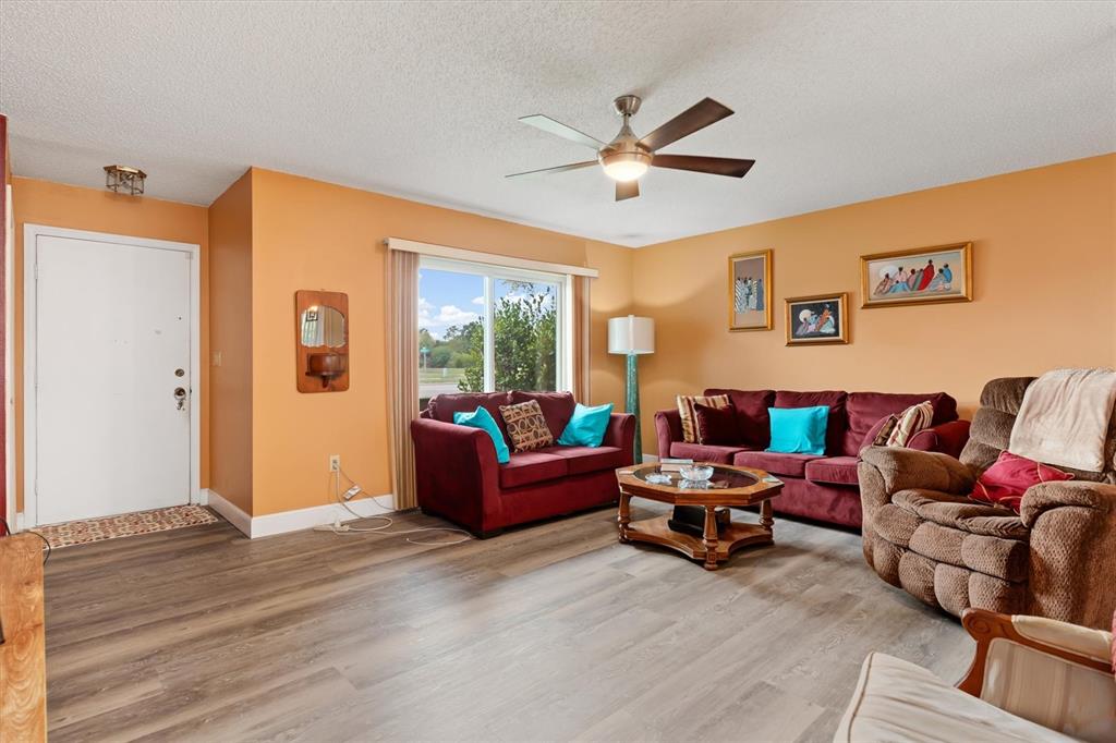 23226 Midway Boulevard Punta Gorda, FL 33980 - Photo 6 of 37 a living room with furniture and a window