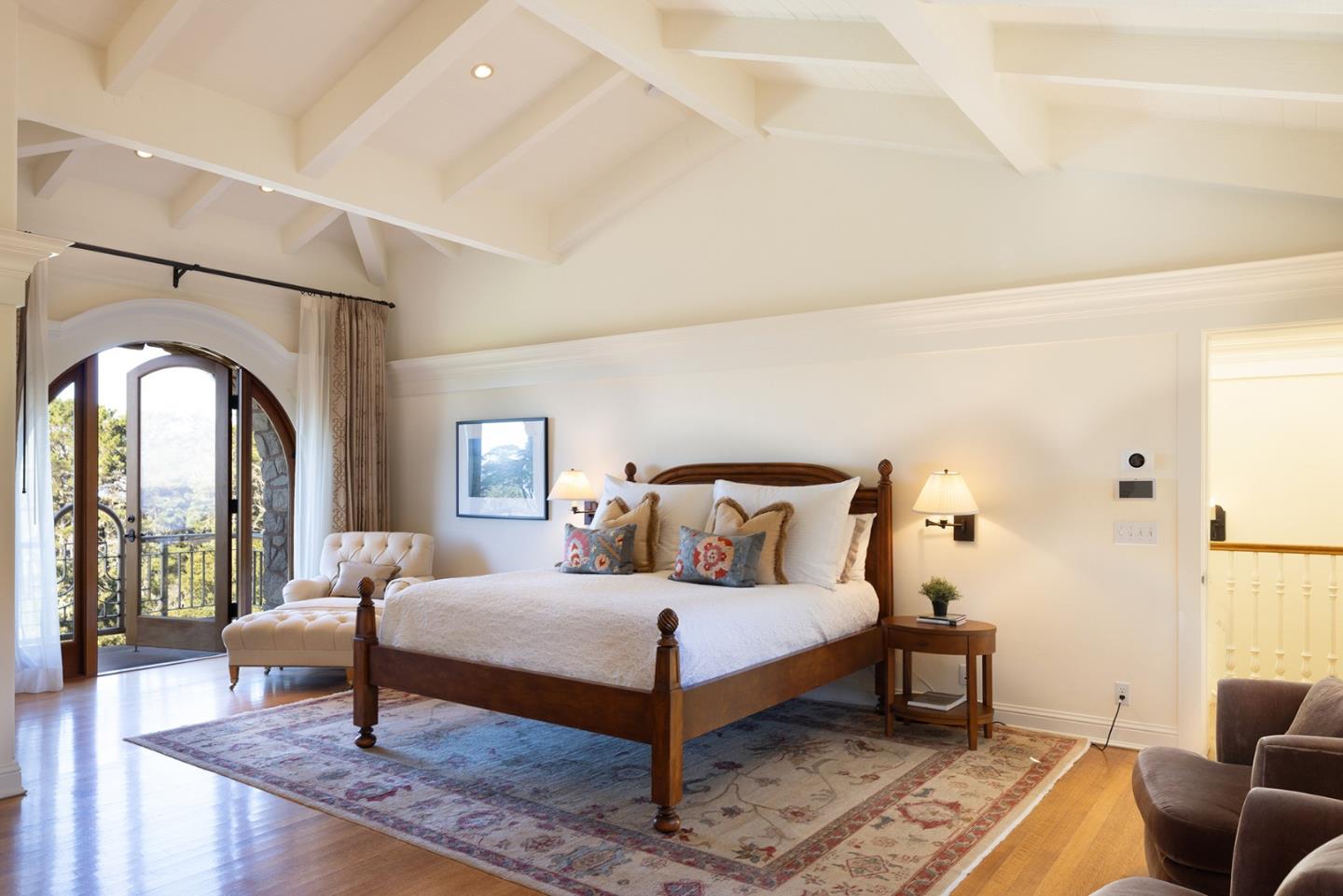 72 Fern Canyon Road Carmel, CA 93923 - Photo 27 of 66 a bedroom with a bed and wooden floor