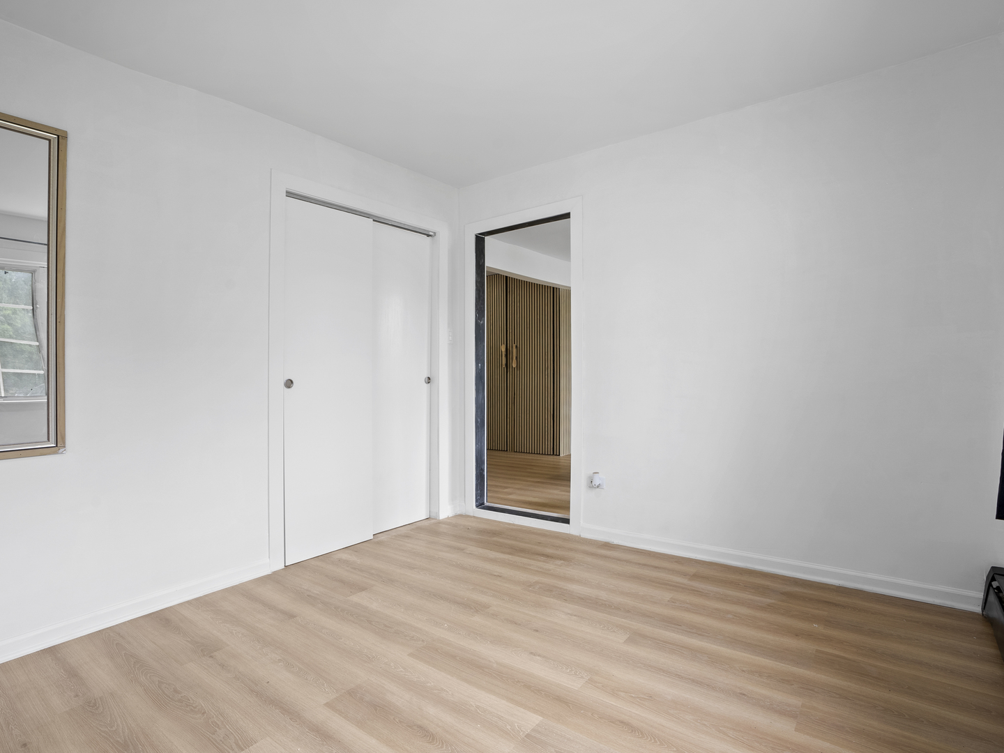 17963 Amherst Court, Unit 102 Country Club Hills, IL 60478 - Photo 8 of 11 a view of empty room with wooden floor