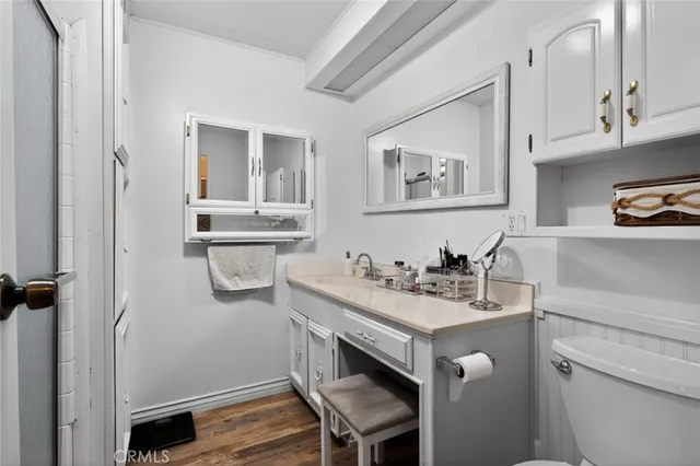 a kitchen with stainless steel appliances granite countertop a sink and a refrigerator