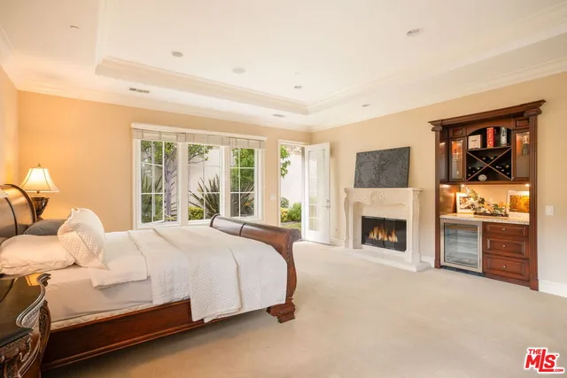 a bedroom with a bed and a fireplace