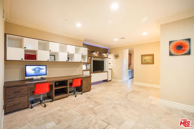 a living room with furniture and flat screen tv