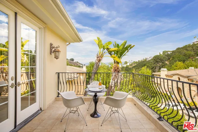 a view of a chairs and table in patio