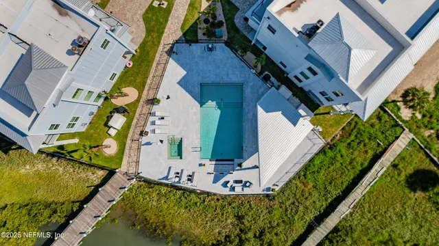 an aerial view of a house with outdoor space