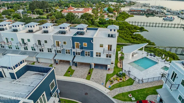 an aerial view of a building with outdoor seating