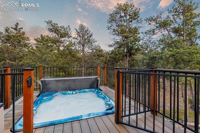 18145 Furrow Road Monument, CO 80132 - Photo 25 of 30 This sunken spa is right off the primary bedroom and has a gate for safety.