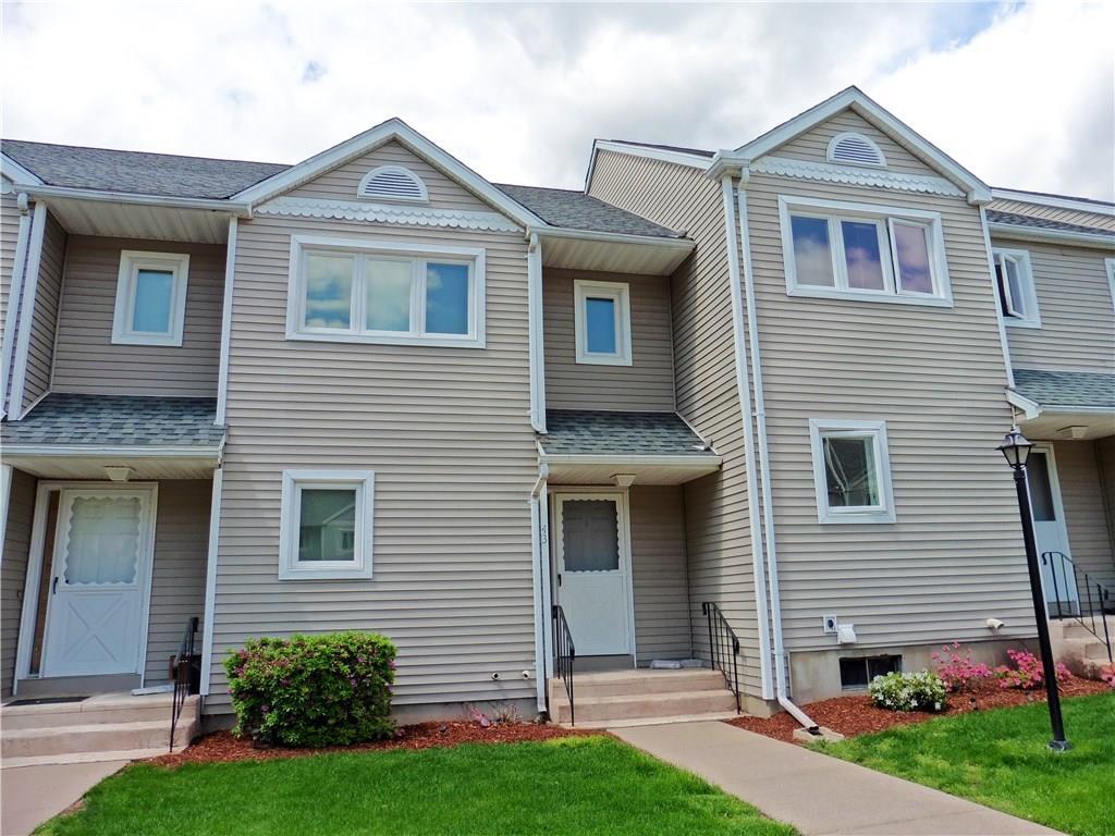 43 Oak Ridge Drive, Unit 43 Windsor Locks, CT 06096 - Photo 1 of 1 a front view of a house with a yard and garage