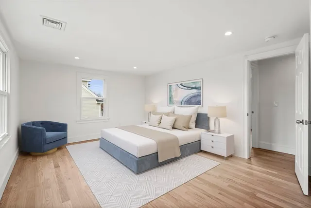 a bedroom with a large bed and a couch