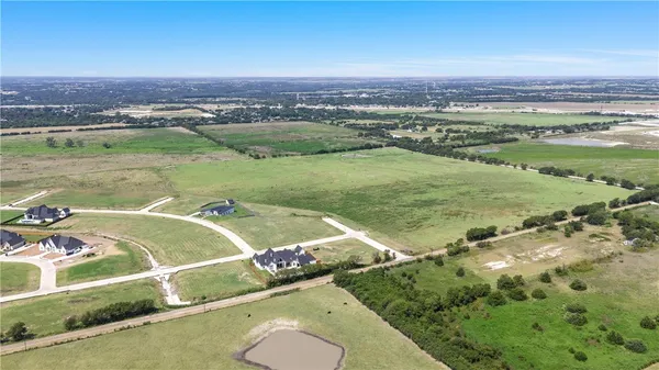 an aerial view of a house with a lake view